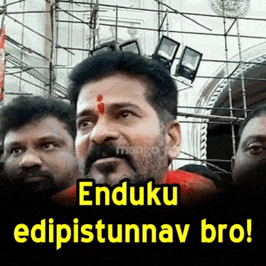 a man with a red bindi on his forehead is surrounded by other men and the caption enduku edipistunnav bro