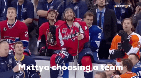 a hockey player sitting in the stands with the words mxtya choosing a team above him