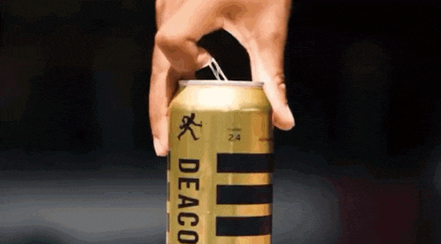 a person is opening a deaco beer can