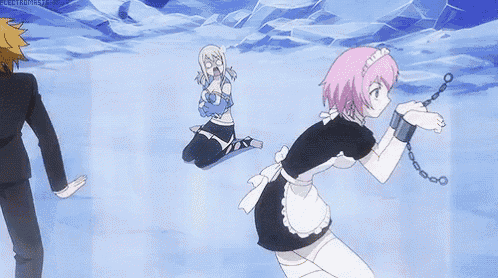 a woman in a maid outfit is chained to a man in a suit while another woman kneeling down .