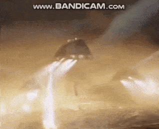 a rocket is flying through the air in a smokey area .
