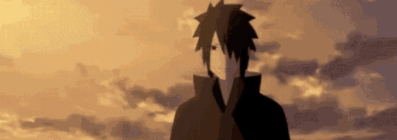 a silhouette of a young man standing in front of a cloudy sky .