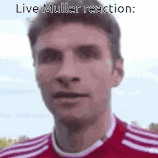 a close up of a man 's face with the words `` live muller reaction '' on it .
