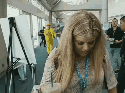 a woman with a lanyard around her neck that says ' sdc ' on it