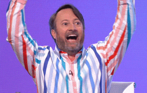 a man in a colorful striped shirt with the letter a on his neck