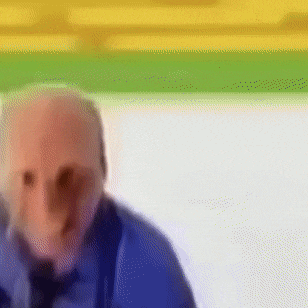 a blurry picture of a man with a blue shirt and tie
