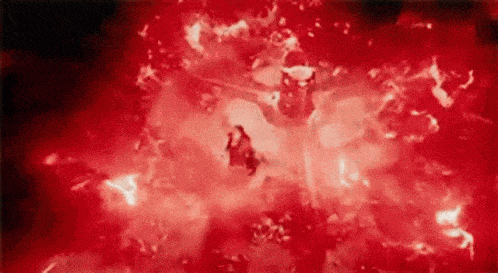 a close up of a person flying through a red light .