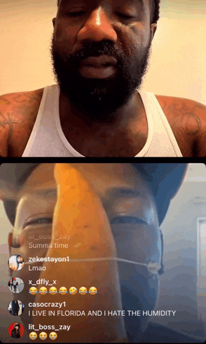 a man with a beard and a white tank top is talking to a group of people