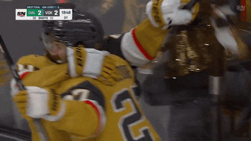 a hockey game is being played and the score is 2 to 1