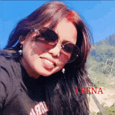 a woman wearing sunglasses has the name leena on the bottom