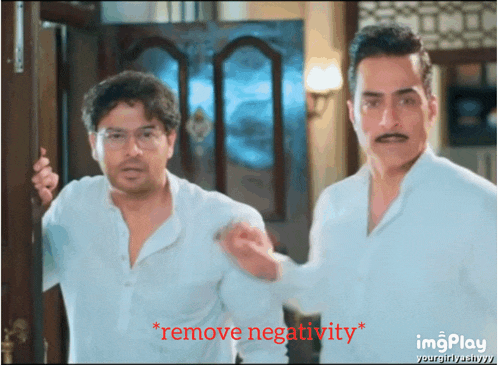 two men are standing next to each other and the words remove negativity are on the bottom