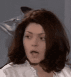 a close up of a woman making a funny face .