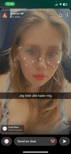 a phone screen shows a girl with glasses and a message that says jeg fører alle hader mig