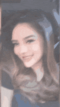 a close up of a woman 's face with a smile on her face