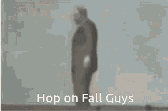 a man in a suit and tie is smiling and saying hop on fall guys .