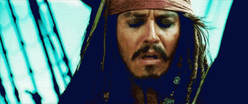 a close up of a man with dreadlocks and a bandana on his head