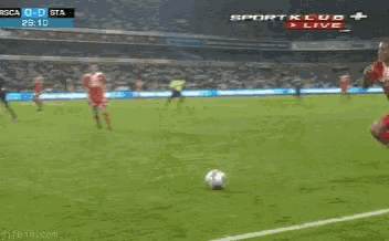a soccer game is being played in a stadium sponsored by sport klub