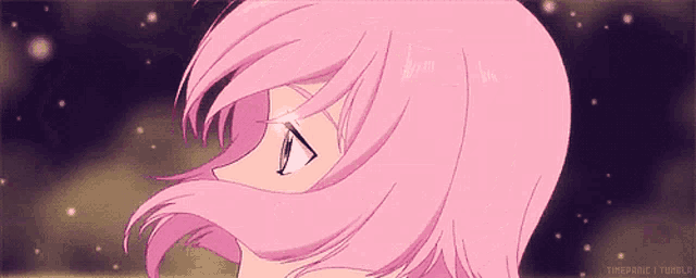a close up of a girl 's face with pink hair and a starry sky in the background .