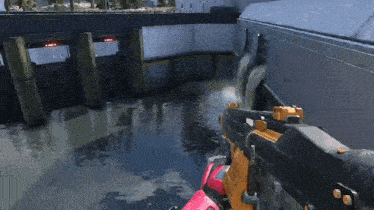 a person is holding a rifle in front of a waterfall in a video game .