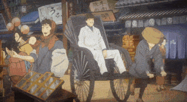 a man is sitting in a rickshaw pulled by a man in a hat