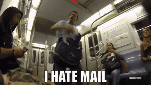 a man carrying a bag on a subway train says " i hate mail "