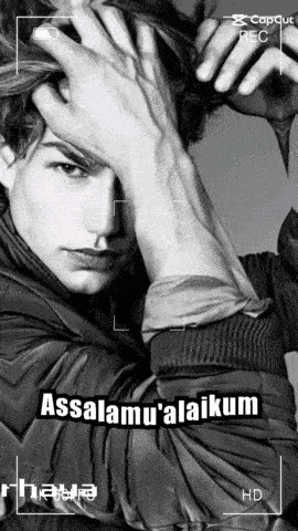 a black and white photo of a man with the caption " assalamu ' alaikum "