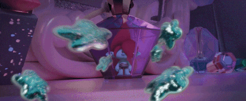 a purple cartoon character is surrounded by purple and blue balls