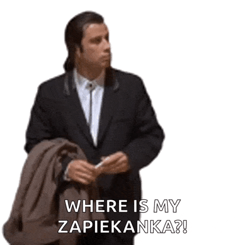 a man in a suit and tie is holding a jacket and asking where is my zapiekanka ?