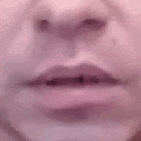 a close up of a person 's mouth with a tooth missing