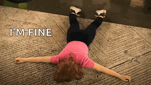 a woman is laying on her back with the words i 'm fine behind her