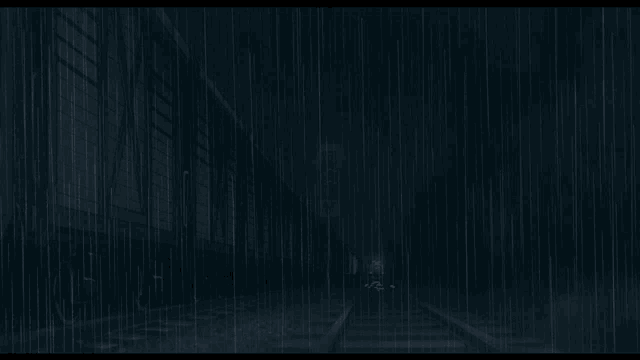 a train going through a tunnel in the rain