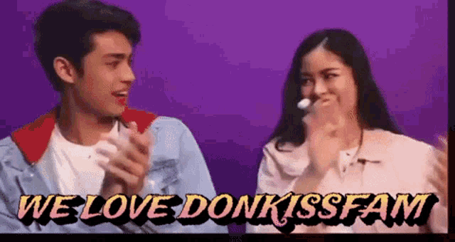 a man and a woman are clapping in front of a purple background and the words we love donkissfam