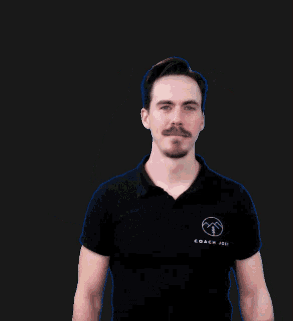 a man with a mustache wearing a black shirt that says coach joe