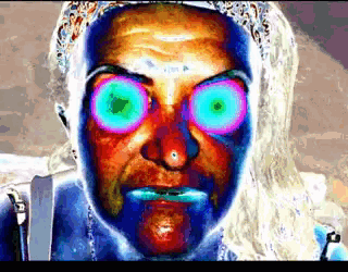 a close up of a person 's face with a purple eye
