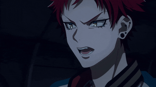 a close up of a person 's face with red hair and blue eyes