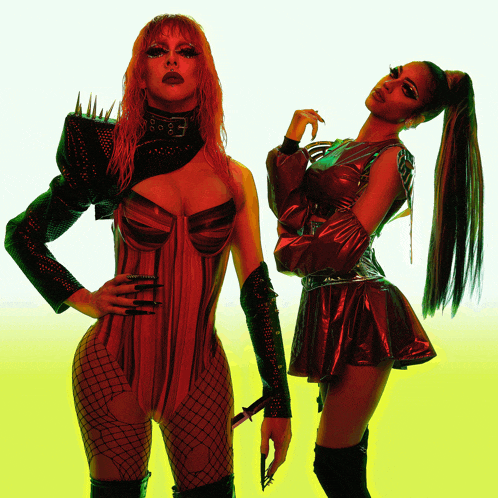 two drag queens are posing for a picture and one has a ponytail