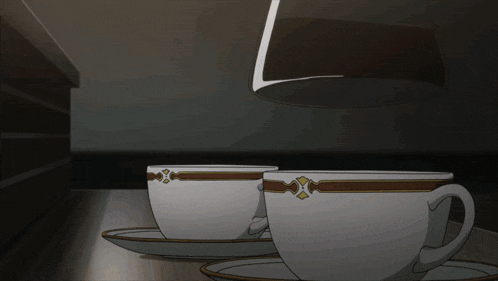 two cups and saucers on a table with a glass being poured into one