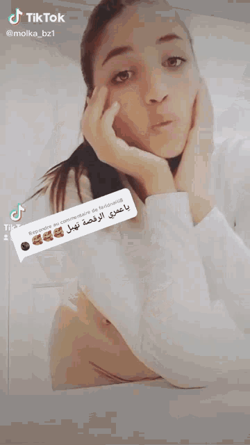 a woman 's face is visible in a tik tok video
