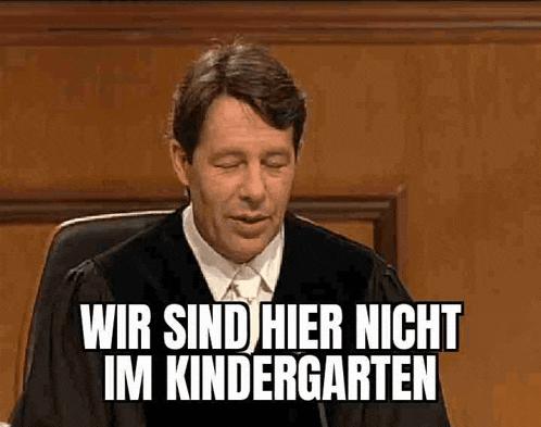 a man in a judge 's robe is sitting in a courtroom and saying wir sind hier nicht im kindergarten