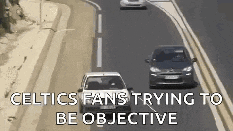 a couple of cars are driving down a highway with the words `` celtics fans trying to be objective '' .