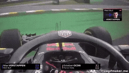 a steering wheel of a race car with red bull on it
