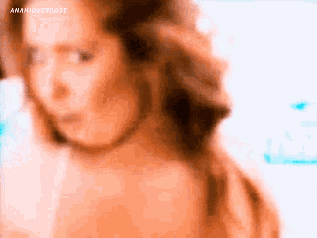 a blurry picture of a woman 's face with anahioverdose written on the bottom right