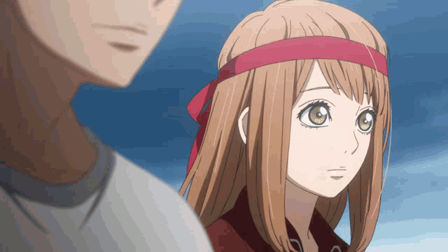a girl with a red headband stands next to a boy
