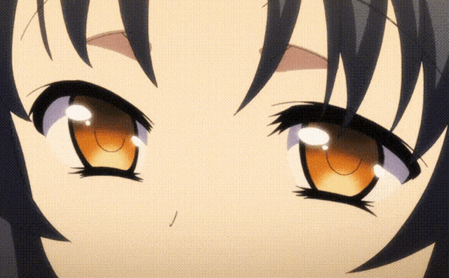 a close up of a girl 's eyes with the letter j visible in the corner