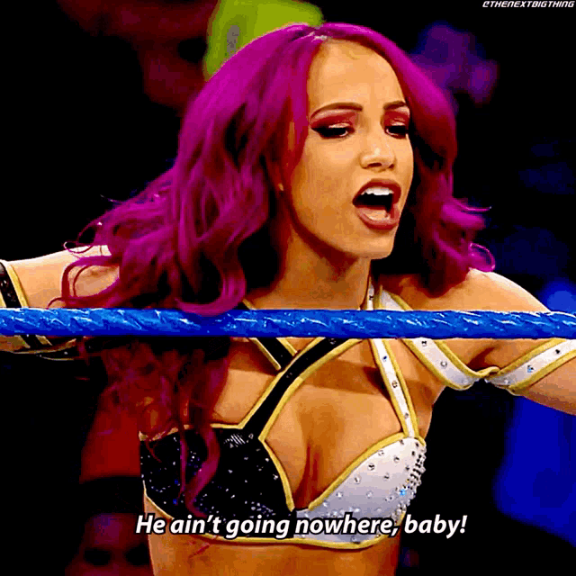 a woman with purple hair is holding a blue rope and says he ain 't going nowhere baby