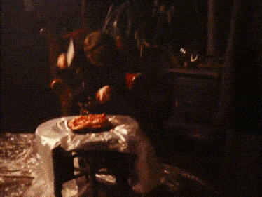 a person is scooping food out of a container with a spoon