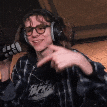 a man wearing headphones and a shirt that says nike on it