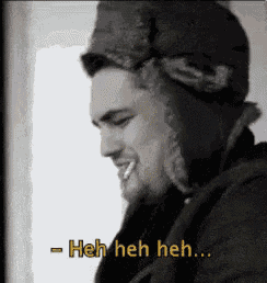 a black and white photo of a man wearing a hat and saying heh heh heh ..