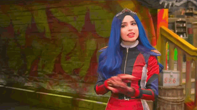 a woman with blue hair and a crown is standing in front of a staircase .