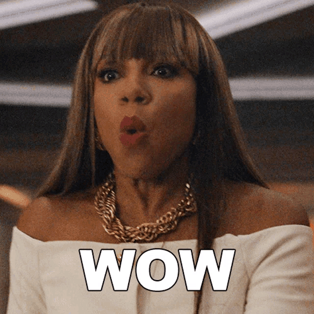 a woman in a white off the shoulder top is making a surprised face next to the word wow